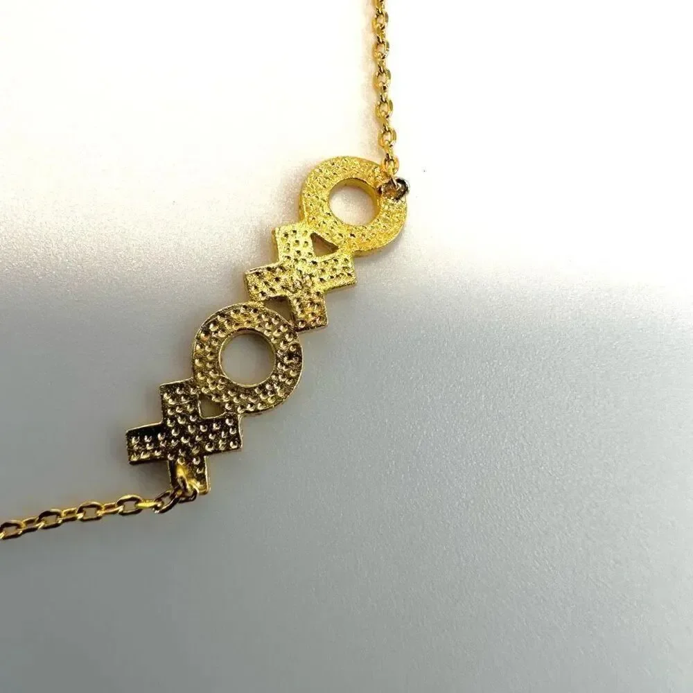 Gold tone XOXO pendant dainty necklace